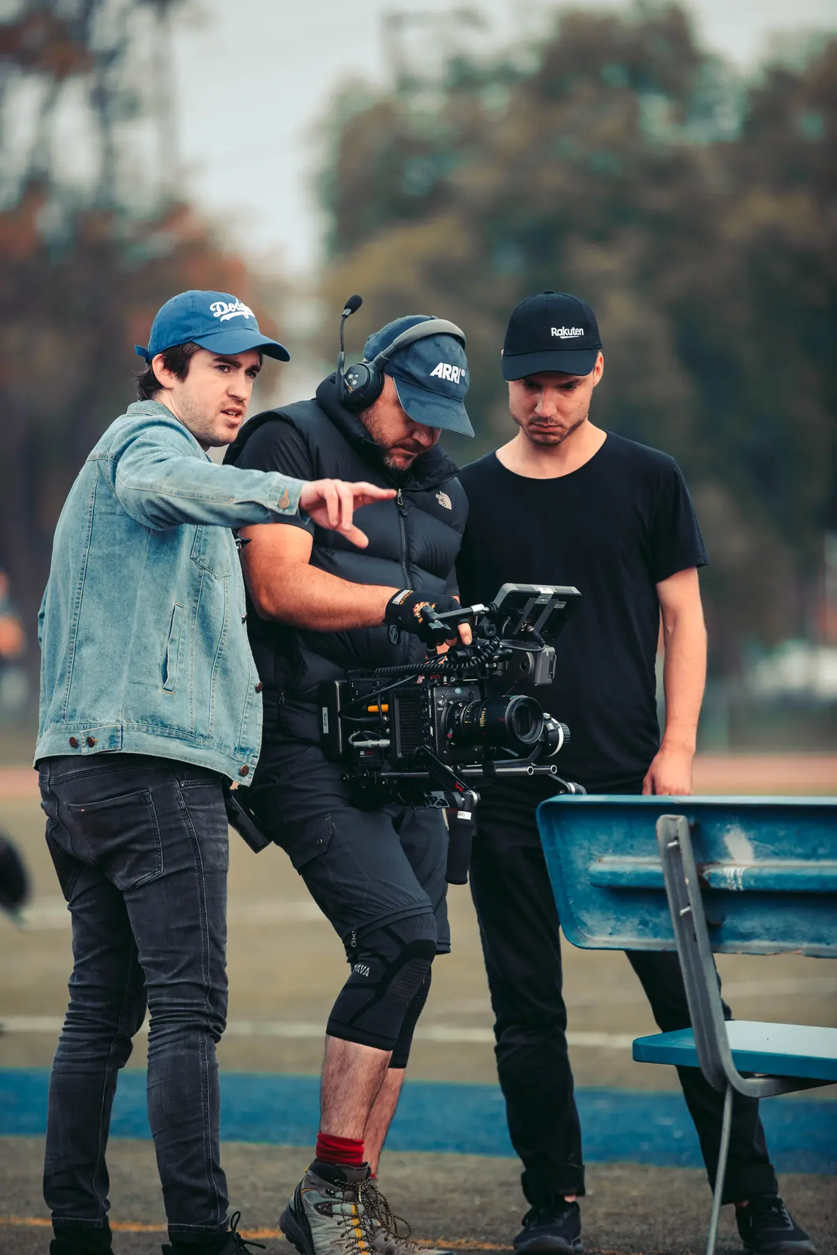 Director framing up a shot with the camera team