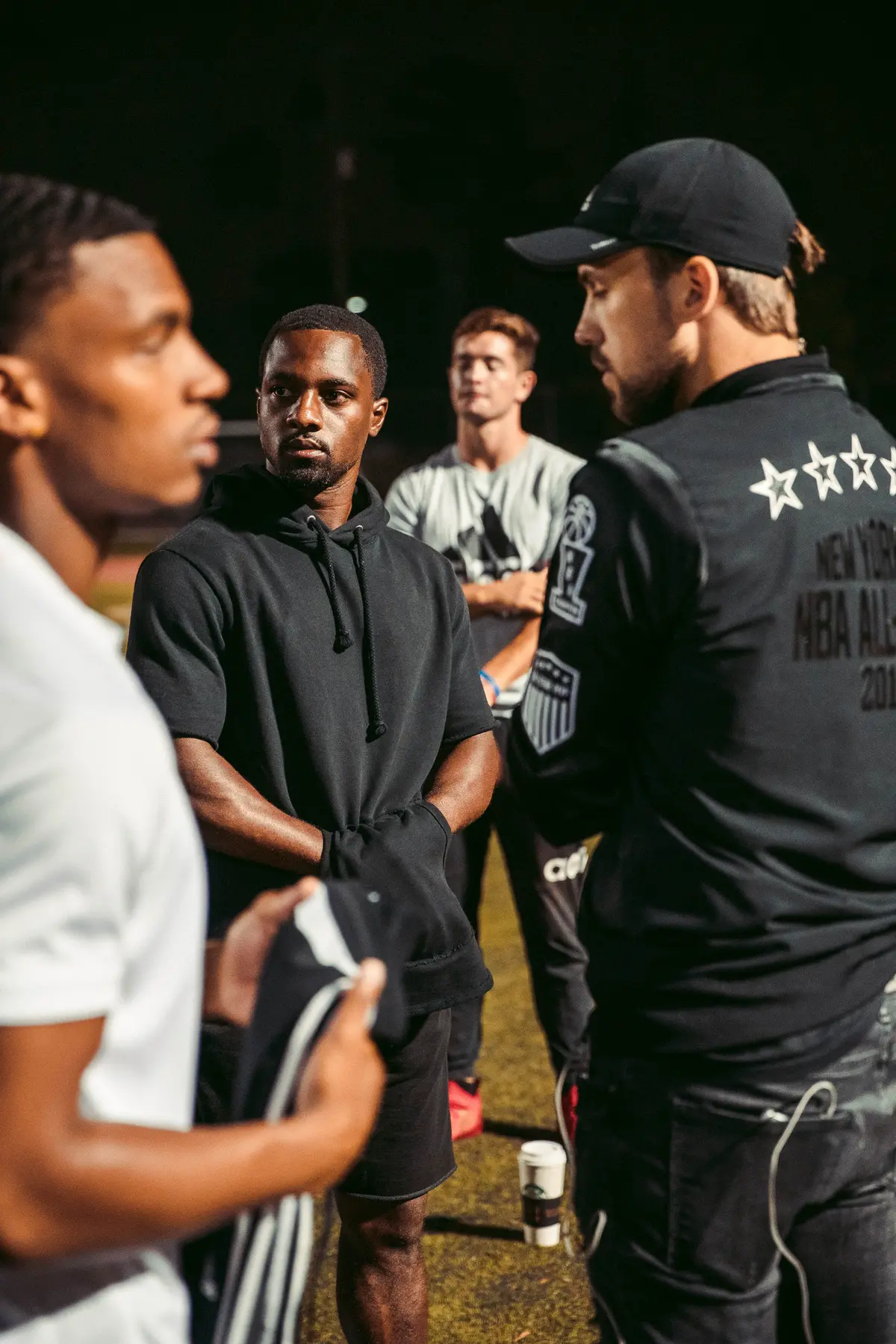 Athletes and crew regrouping between takes