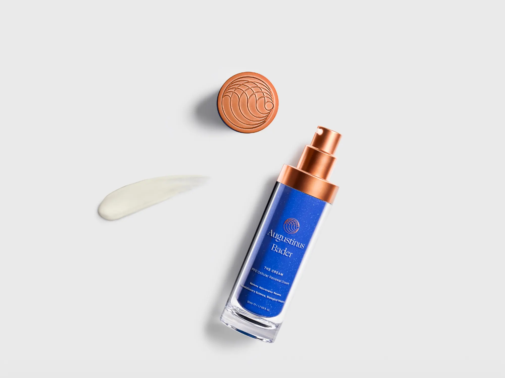 The Cream laid flat beside its copper cap and a swatch of product