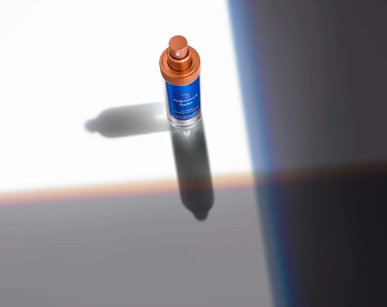 Single bottle casting a long shadow across a lit grey surface